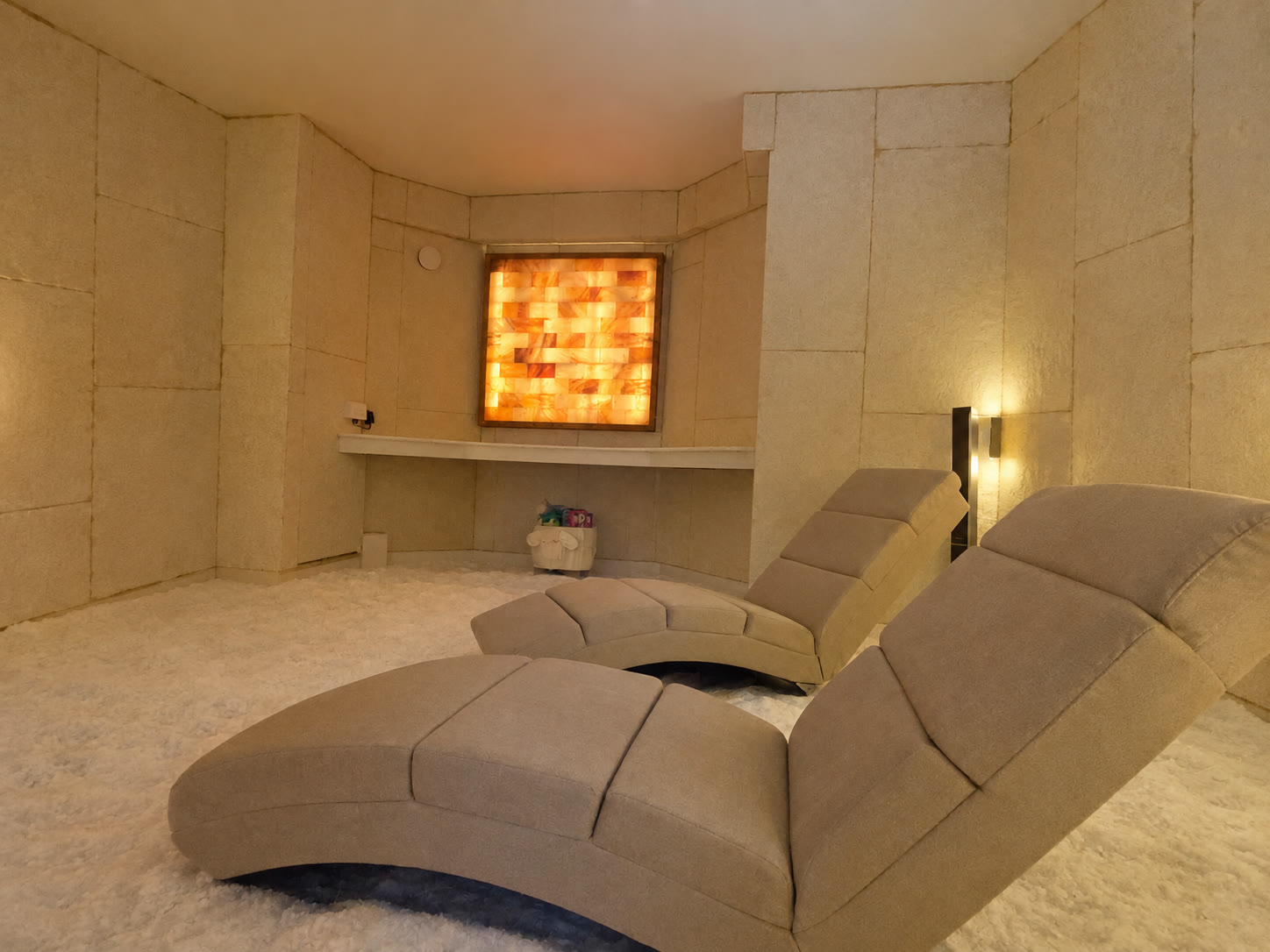 Two recliners in front of the salt panel and its little shelf