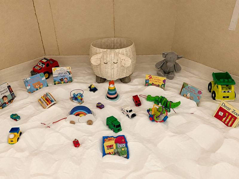 Toys and books on the salt floor of the children's play corner